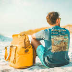 man on the beach in graphic tee