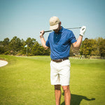 man on golf course in polo